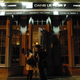 Patrons enter the restaurant Dans Le Noir in London, England, in 2006.